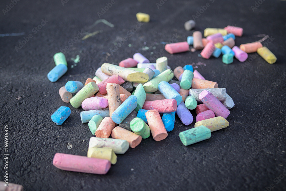 Colorful Pile of Chalk Laying on Sidewalk Colorful Pile of Chalk Laying on Sidewalk