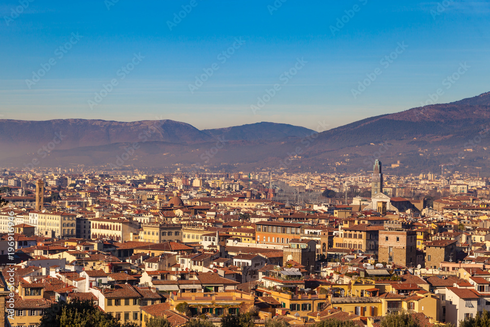 View of the historic center of Florence from a height, yellow houses and roofs terracotta color, Italy