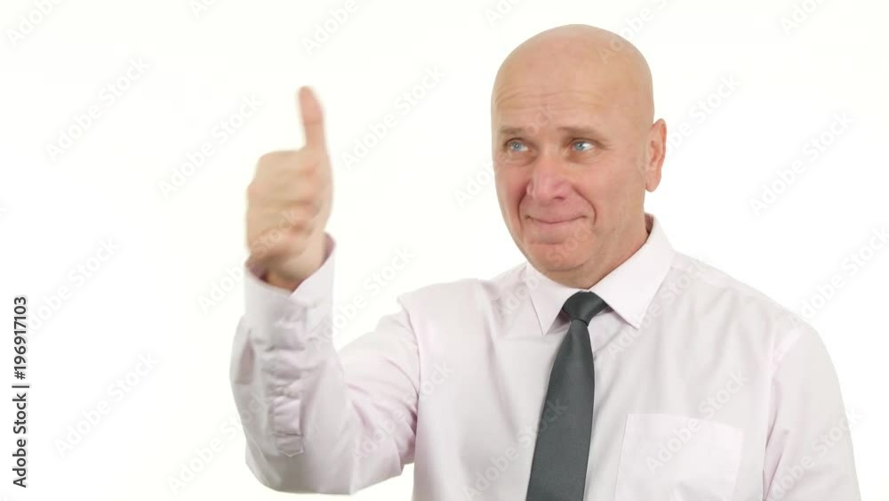 Trustful Businessman Pointing with Finger and Thumbs Up Smiling Confident Trustful Businessman Pointing with Finger and Thumbs Up Smiling Confident