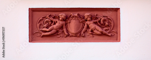Fotografie Ornaments with putti on a historic house from 1888 in Greifswald, Germany