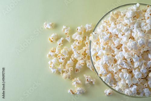 Popcorn on a bright yellow background top view