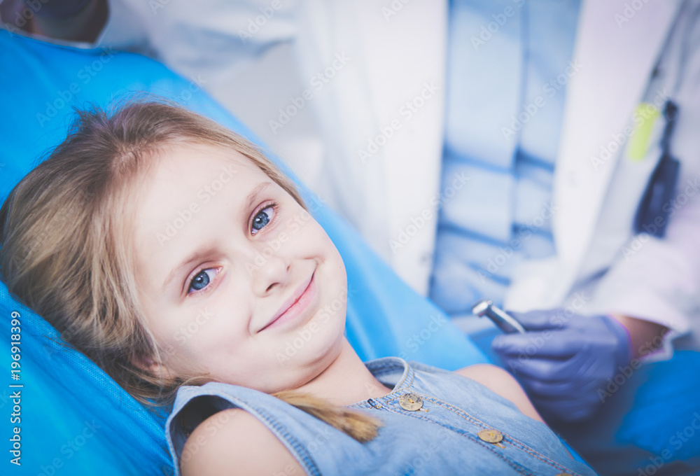 Little girl sitting in the dentists office Little girl sitting in the dentists office