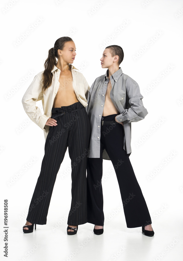 Two Topless girls posing on a white background. Two Topless girls posing on a white background.