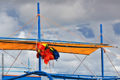 Balangay or bangka boat stranded-life savers hanging. Punta Ballo beach-Sipalay-Philippines. 0318 photo