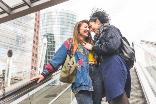 Lesbian couple in Berlin laughing and having fun together