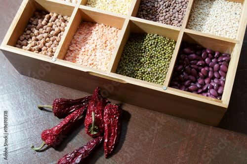 A box of different kinds of lentils photo