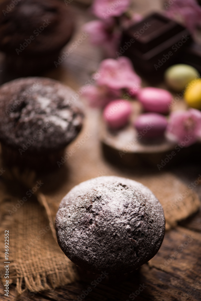 Fototapeta premium Chocolate muffin. Homemade bakery on wooden background