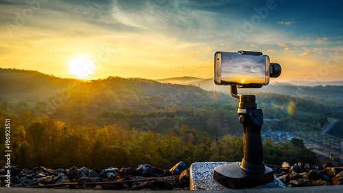 Obraz na plátně Close-up Smartphone take a Mountians Landscape photo and video timelapse on stan