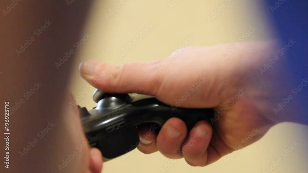 Man playing video game with a joystick. Man playing video game with a joystick.