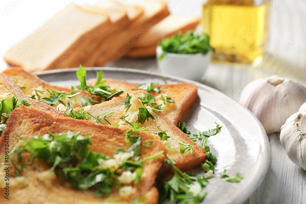 Plate with delicious homemade garlic bread, closeup Plate with delicious homemade garlic bread, closeup