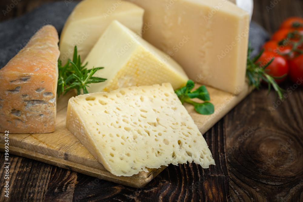 Cheeses with basil, rosemary and tomatoes.