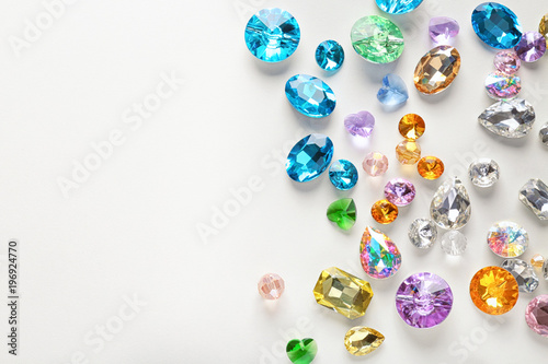 Colorful precious stones for jewellery on white background photo
