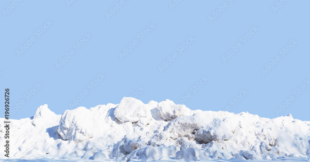 Fototapeta premium Snow pile, hill. Large snow drift isolated on a blue sky background, close-up. Panoramic view. Winter in the mountains. Hummock, avalanche