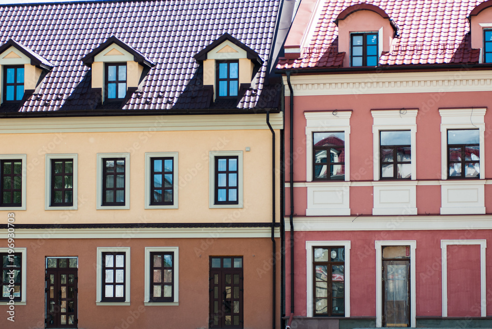 Colorful buildings with many windows located on little street in Ukraine