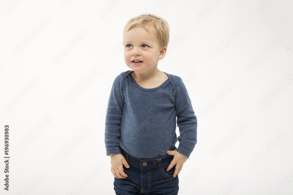 Shy baby boy isolated on white background. Cute toddler with asking face expression. Adorable kid asking what is going on. Copy space Shy baby boy isolated on white background. Cute toddler with asking face expression. Adorable kid asking what is going on. Copy space