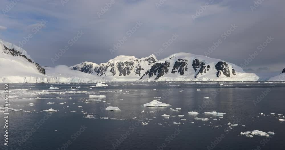 Chunks of ice fall off the glaciers near Paradise Harbor in Antarctica, where a large colony of Gentoo Penguins live. Scientists and researchers are studying the effects of climate change in that area Chunks of ice fall off the glaciers near Paradise Harbor in Antarctica, where a large colony of Gentoo Penguins live. Scientists and researchers are studying the effects of climate change in that area