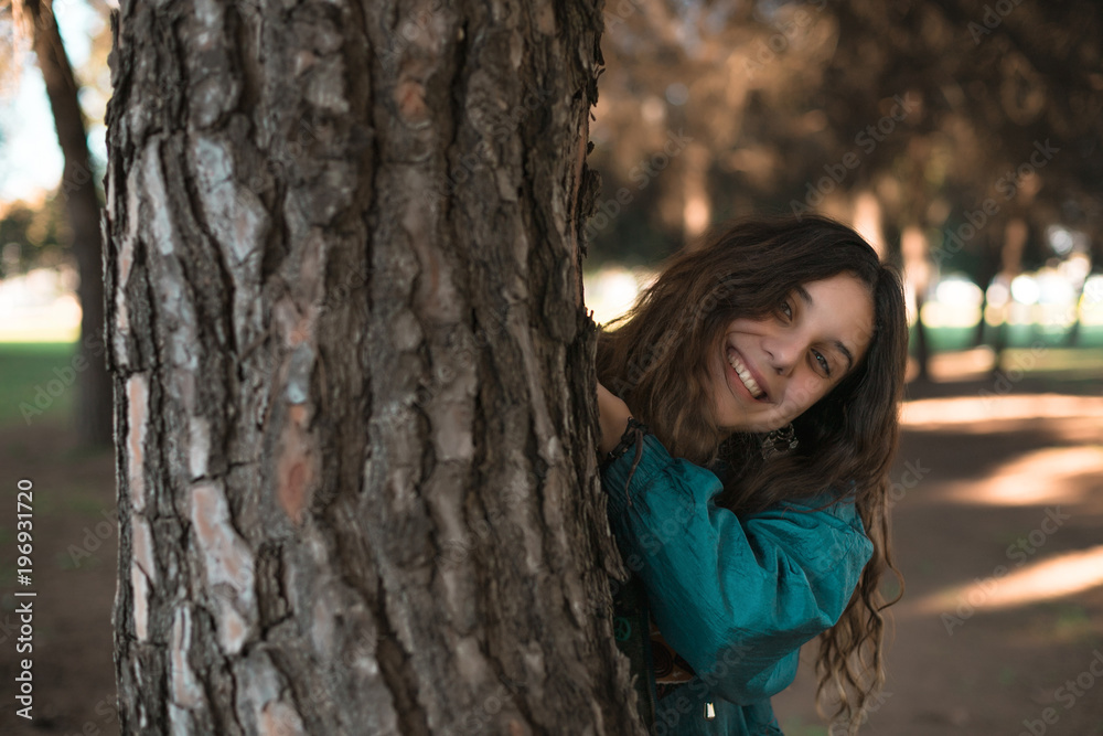 An attractive girl having fun in a sunny day inside a park in Seville, Spain. An attractive girl having fun in a sunny day inside a park in Seville, Spain.