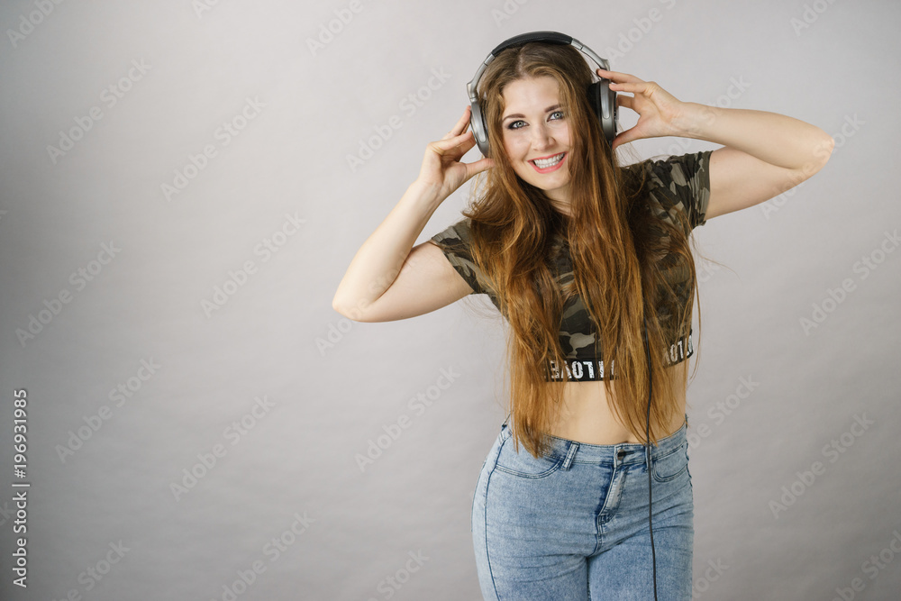 Teen women wearing headphones Teen women wearing headphones