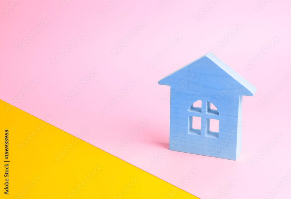 Blue wooden house on a pink background in pop style. The concept of renting, selling and buying a home. Juicy colors and fresh colors. Real estate market, realtors. Affordable youth housing. Blue wooden house on a pink background in pop style. The concept of renting, selling and buying a home. Juicy colors and fresh colors. Real estate market, realtors. Affordable youth housing.