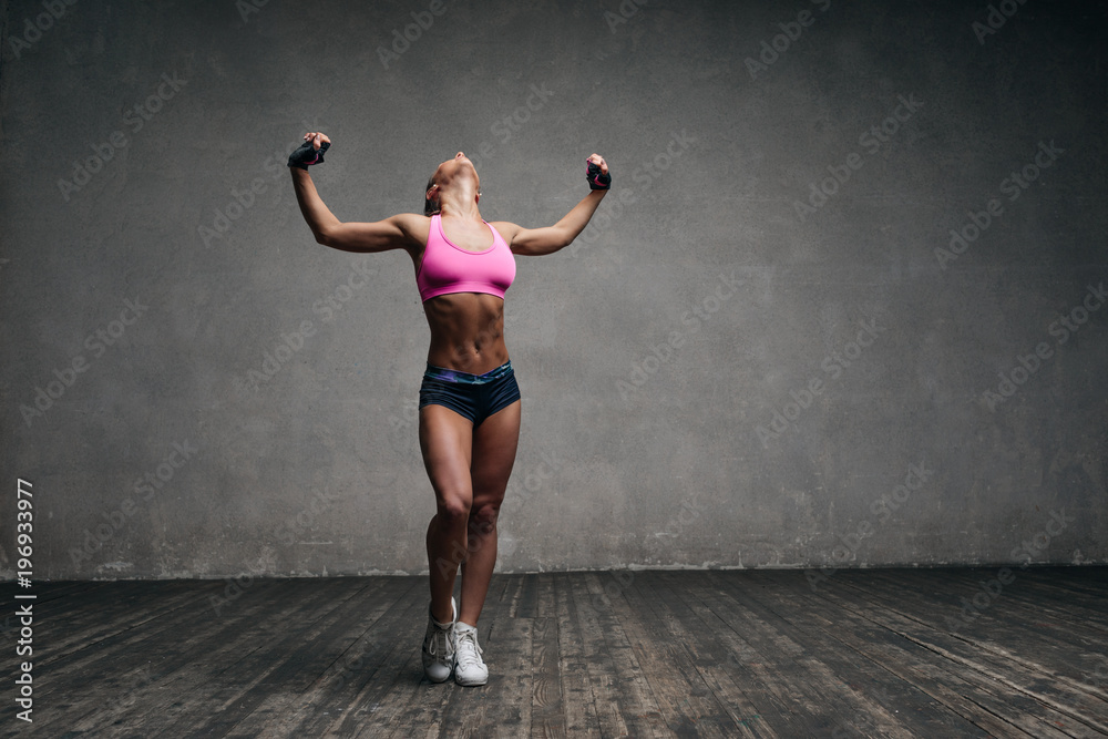 Young beautiful athlete is posing in studio Young beautiful athlete is posing in studio
