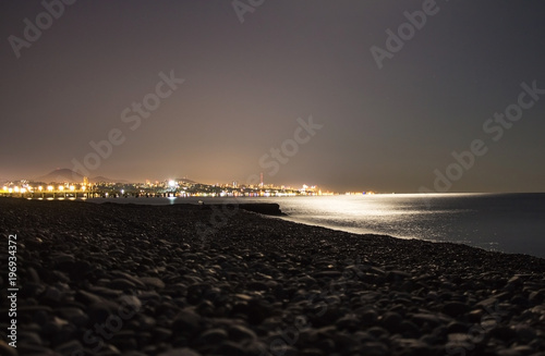 Bright lights and reflections in the sea, the big city.  Sochi, Russia