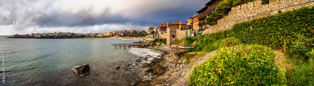 Seaside landscape, panorama, banner - embankment with fortress wall in the city of Sozopol on the Black Sea coast in Bulgaria