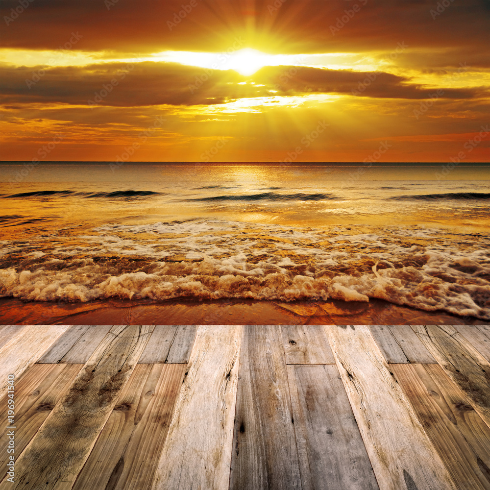 Beautiful sandy beach in sunrise With Wooden Floor for background