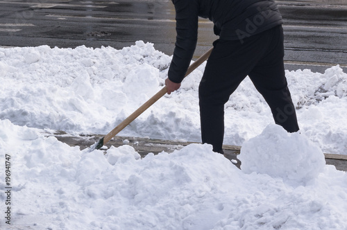 Snow cleaning with a shovel after a snowstorm