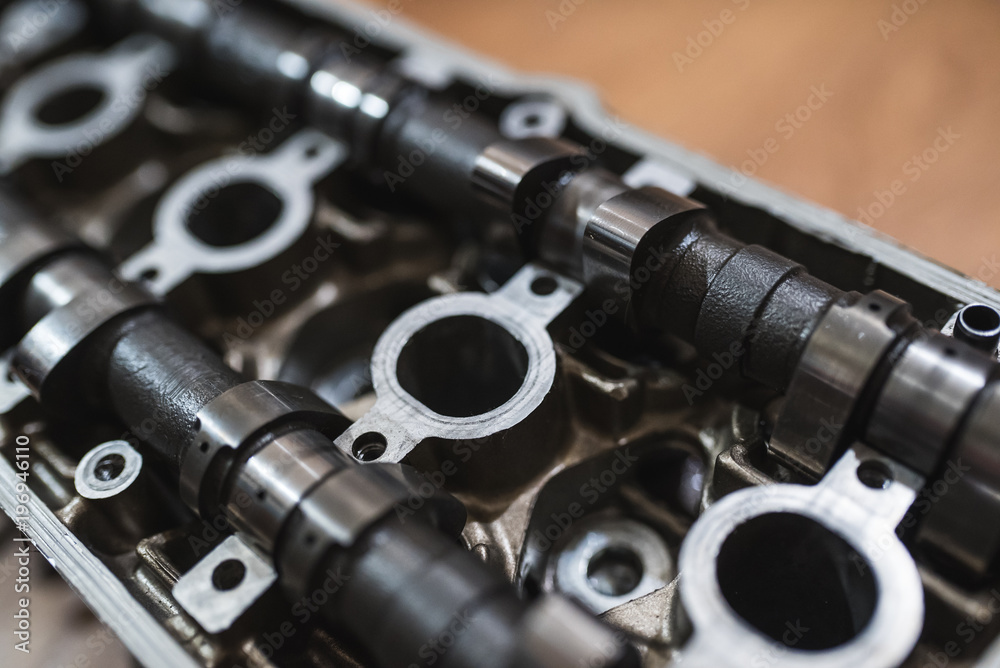 Motor head, valve, cam-shaft, from a motorcycle or car. Close-up shot 