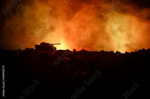 War Concept. Military silhouettes fighting scene on war fog sky background  World War German Tanks Silhouettes Below Cloudy Skyline At night. Attack scene. Armored vehicles. Tanks battle. Close up