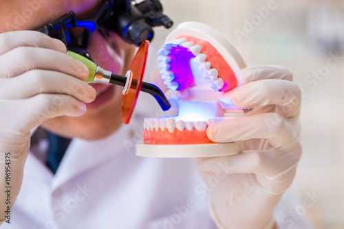 Photography Young dentist working in the dentistry hospital