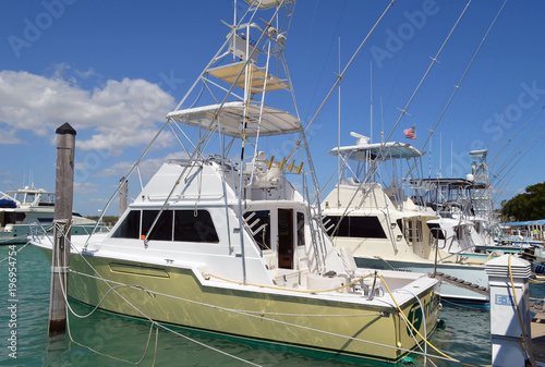 Charter deep sea fishing boats moored at a marina on Haulover Beach inlet in southeast florida © Wimbledon