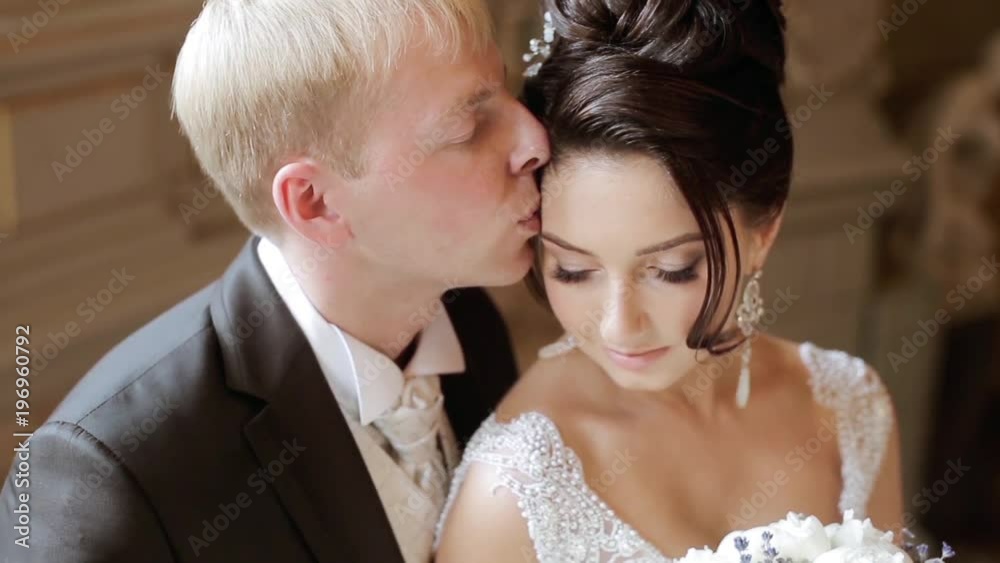 Wedding couple indoors is hugging each other Wedding couple indoors is hugging each other
