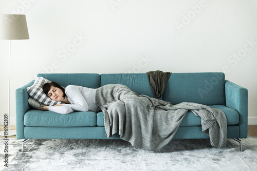 Woman sleeping on the sofa photo
