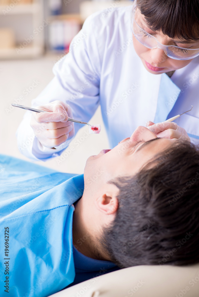 Patient visiting dentist for regular check-up and filling Patient visiting dentist for regular check-up and filling
