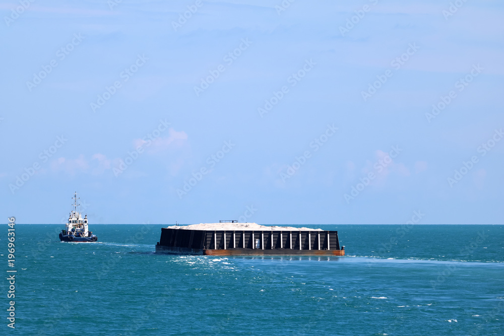 Towing boat or Cargo ship moving into the sea,Transportation and industrial