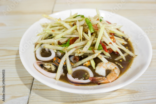 Thai Spicy papaya salad with seafood, Famous Thai food, "Somtum"