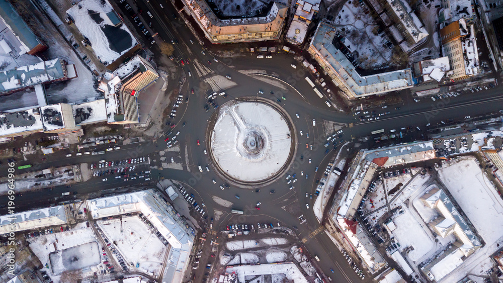 City square with car traffic view from above. City landscape with a quadrocopter City square with car traffic view from above. City landscape with a quadrocopter