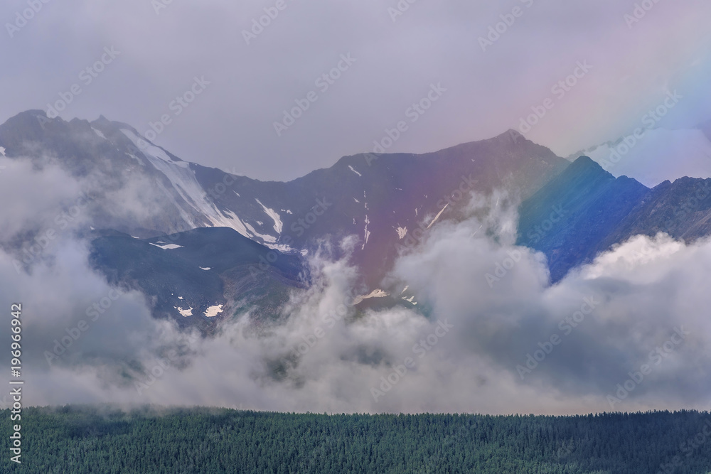 Fototapeta premium mountains rainbow forest clouds