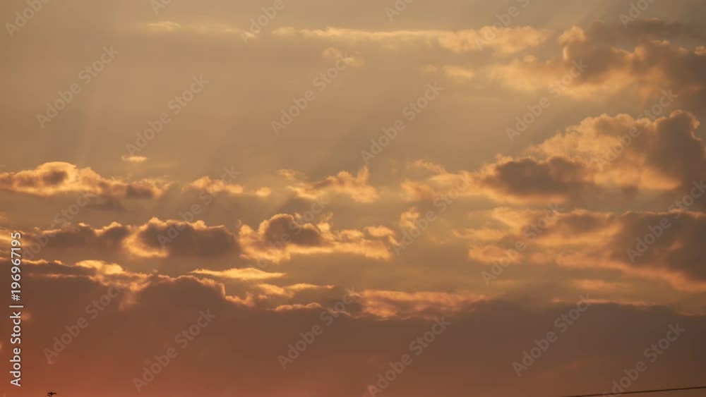 Beautiful Summer Cloudy Sky in Sunset Evening Light with Beautiful Warm Colors Beautiful Summer Cloudy Sky in Sunset Evening Light with Beautiful Warm Colors