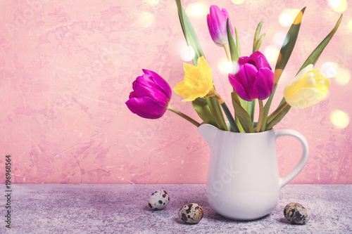 Fototapeta Naklejka Na Ścianę i Meble -  Spring bouquet of tulips and daffodils in a white vase