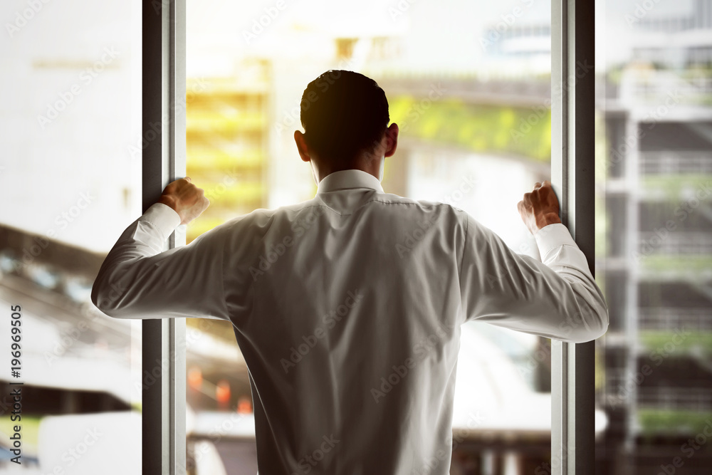 Businessman looking out