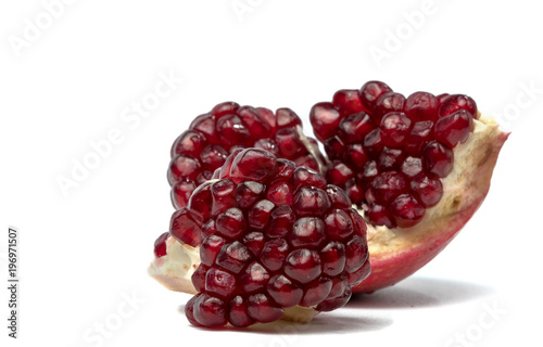 Pomegranate grains isolated on white background.