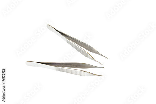 Surgical Instruments  tweezers  pliers  clamp the blade  scalpel  scissors  on a white table.