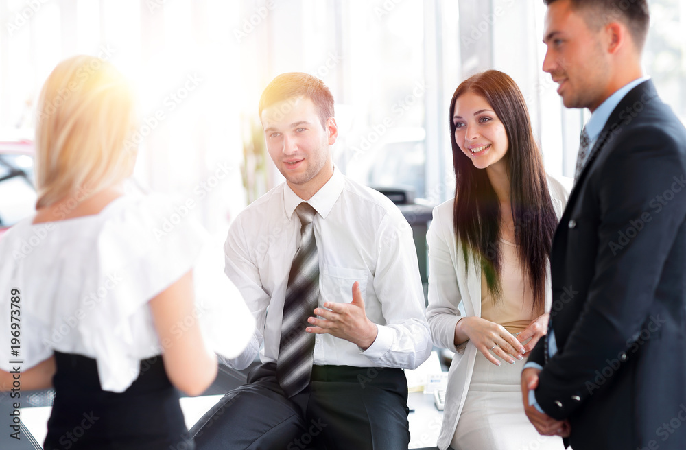 Business team discussing business issues in office workplace Business team discussing business issues in office workplace
