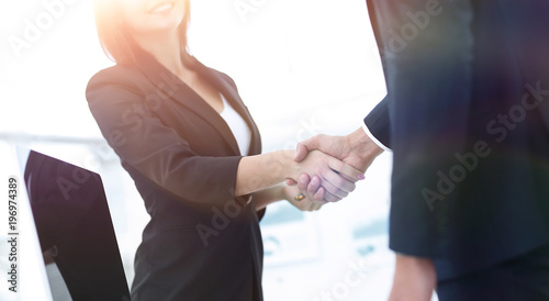 business colleagues shaking hands after a successful presentatio
