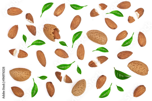 almonds decorated with leaves isolated on white background. Flat lay pattern. Top view