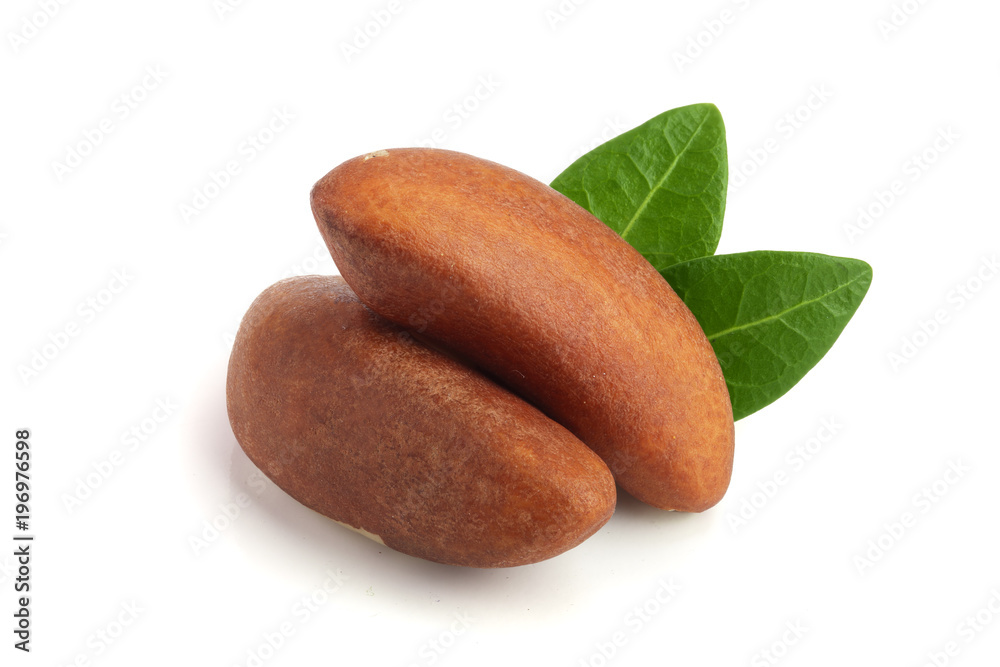 Obraz premium Brazil nuts with leaves isolated on white background closeup. Full depth of field