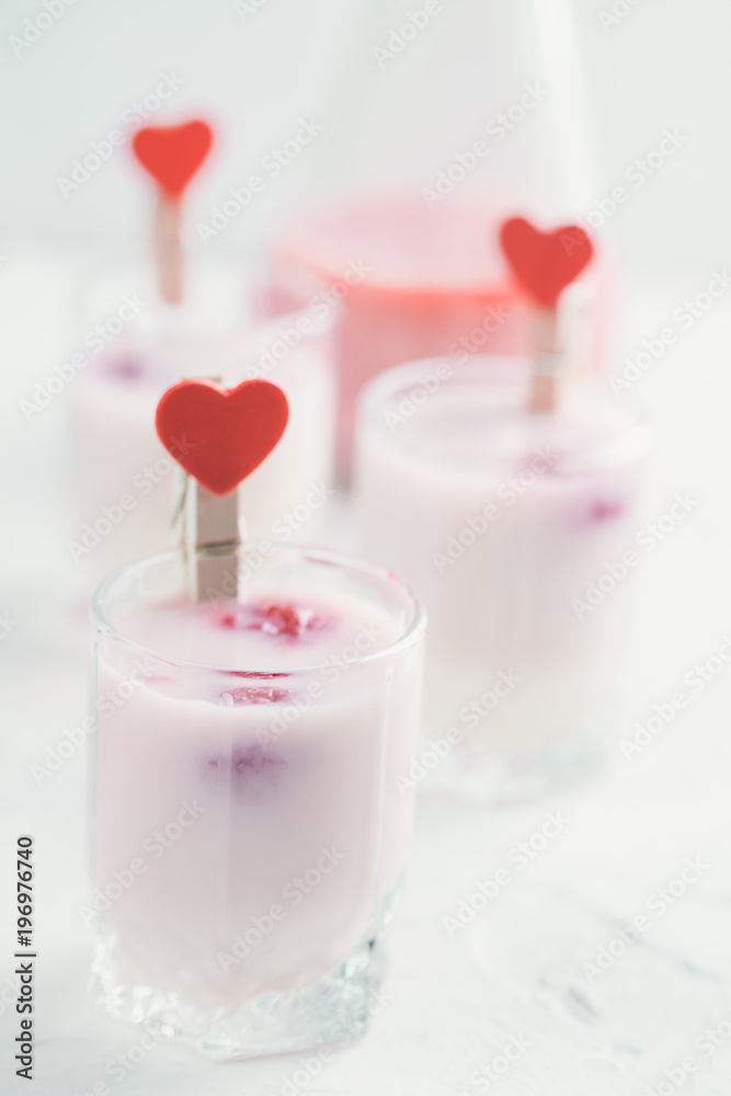 Baileys cocktail shots with milk and raspberries. Free space for text.