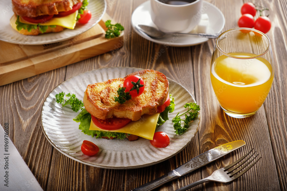 Sandwich of croutons with coffee and orange juice. Sandwich of croutons with coffee and orange juice.
